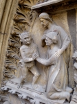 Christ avocat détail Tympan gothique de circa 1250 sur la façade nord (Notre-Dame de Paris) légende de Théophile.jpg